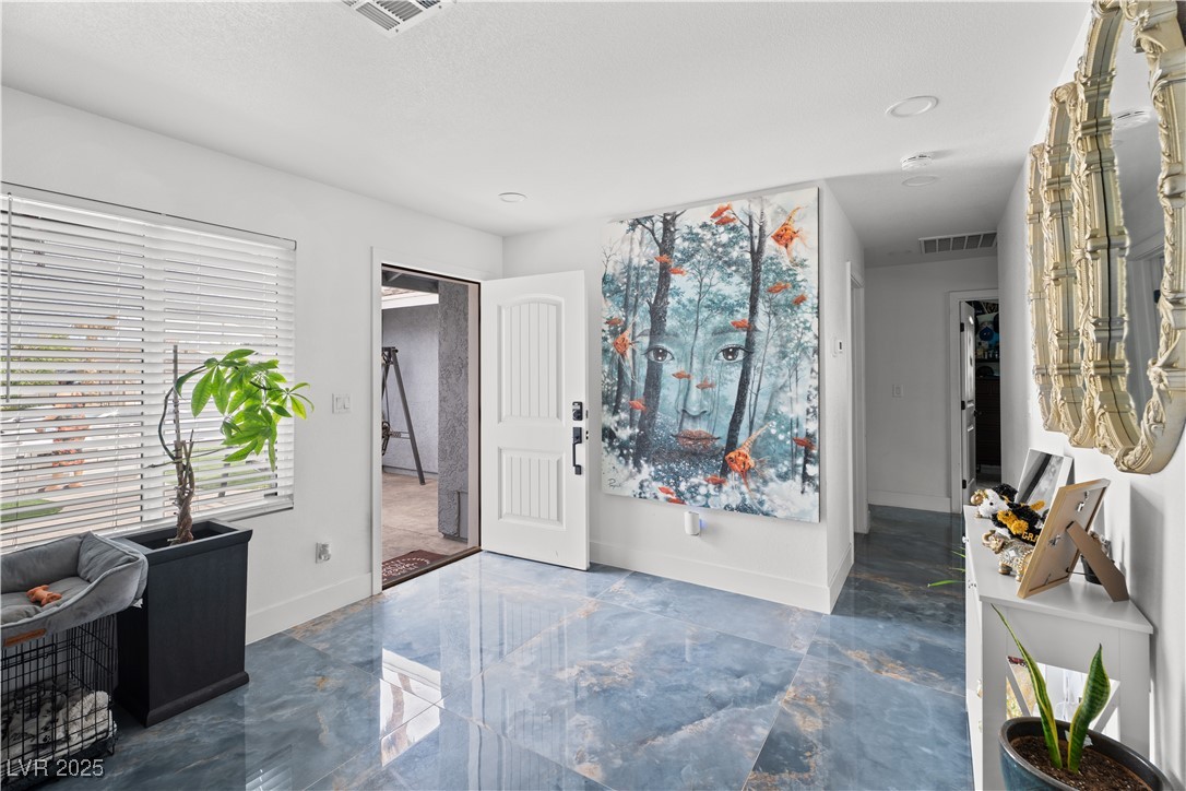 4231 Rimcrest Road Las Vegas, NV 89121 - Photo 11 of 52 Entryway with marble tiled floors and baseboards