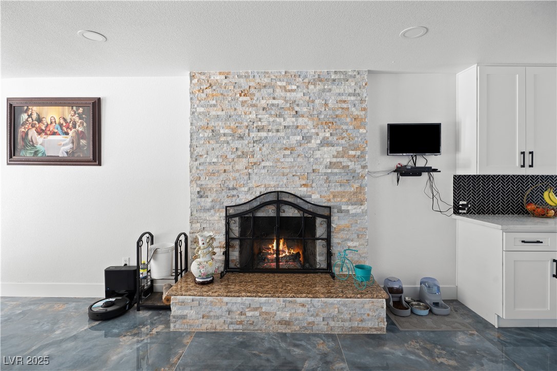 4231 Rimcrest Road Las Vegas, NV 89121 - Photo 20 of 52 Living area with a fireplace, a textured ceiling, and recessed lighting