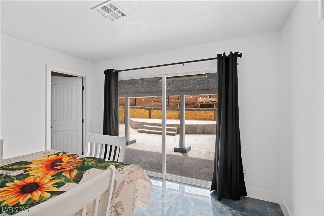 4231 Rimcrest Road Las Vegas, NV 89121 - Photo 22 of 52 Bedroom featuring access to exterior and marble finish floors