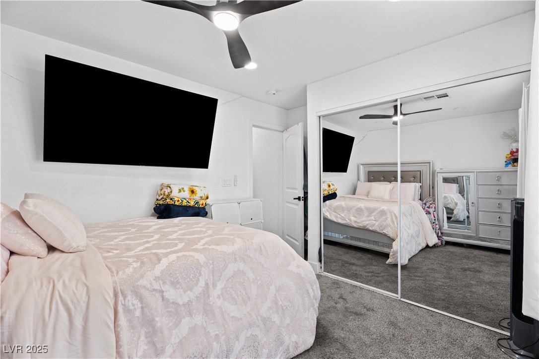 4231 Rimcrest Road Las Vegas, NV 89121 - Photo 30 of 52 Carpeted bedroom with a closet and a ceiling fan