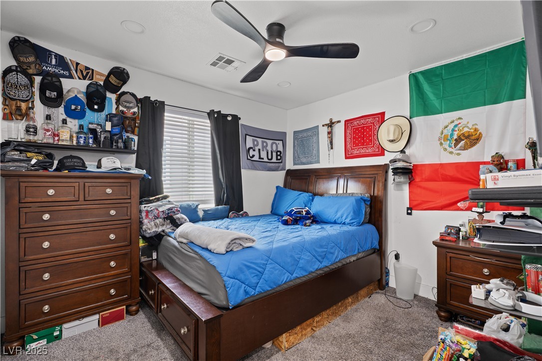 4231 Rimcrest Road Las Vegas, NV 89121 - Photo 32 of 52 Carpeted bedroom with a ceiling fan and recessed lighting