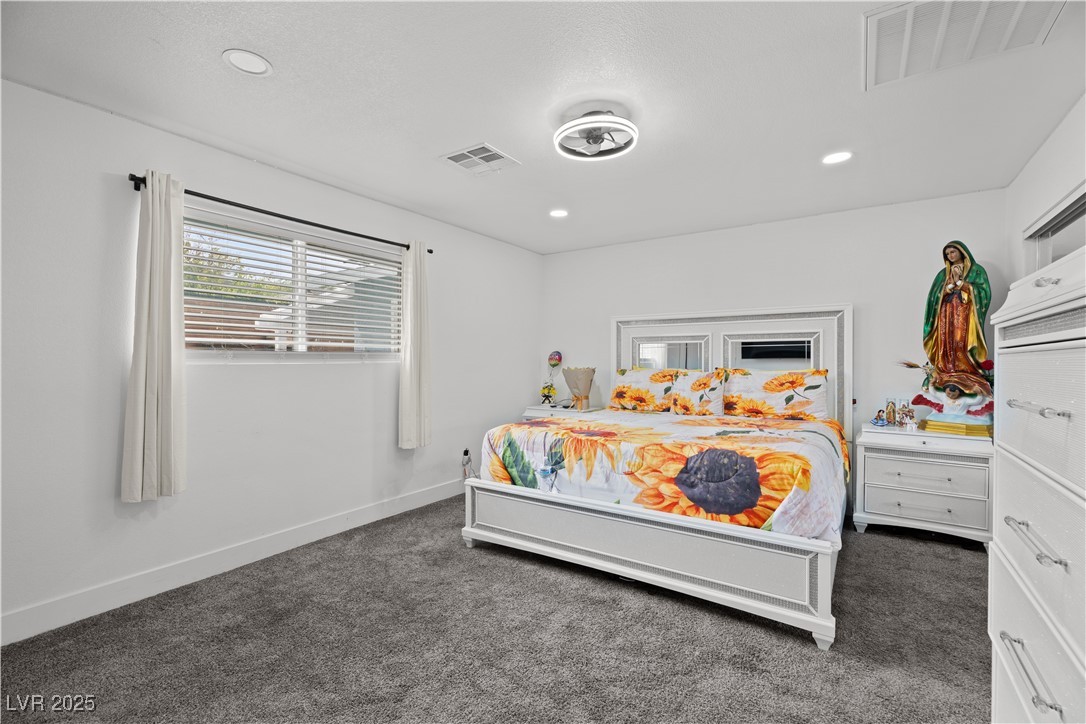 4231 Rimcrest Road Las Vegas, NV 89121 - Photo 33 of 52 Carpeted bedroom featuring recessed lighting and baseboards