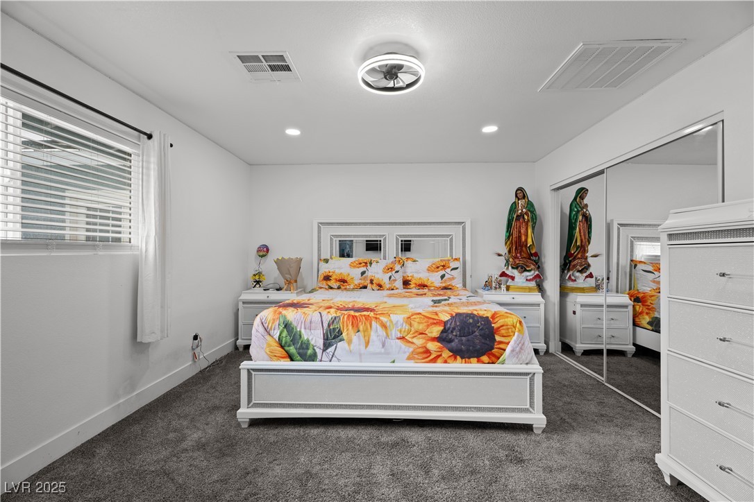 4231 Rimcrest Road Las Vegas, NV 89121 - Photo 35 of 52 Bedroom with recessed lighting, dark colored carpet, and a closet