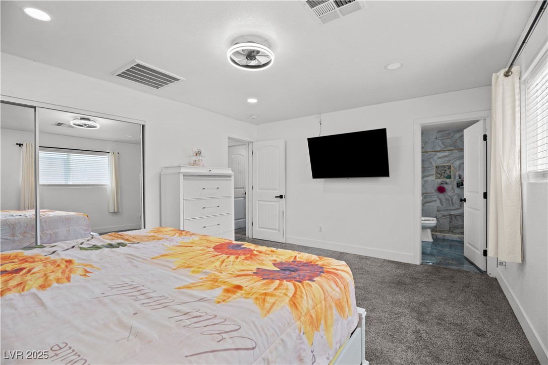 4231 Rimcrest Road Las Vegas, NV 89121 - Photo 36 of 52 Bedroom featuring dark carpet, recessed lighting, and connected bathroom