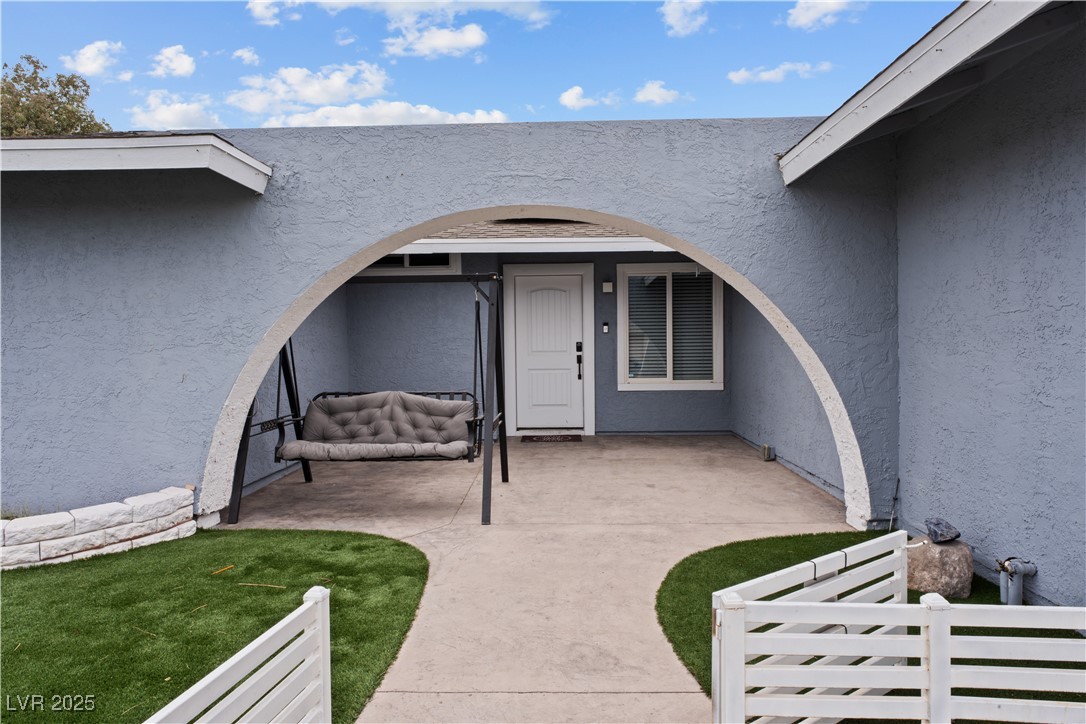 4231 Rimcrest Road Las Vegas, NV 89121 - Photo 6 of 52 Property entrance featuring stucco siding and a patio area