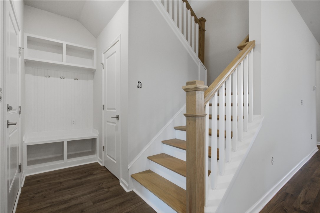 552 Hydrangea Street, Unit LOT 66 Seneca, SC 29678 - Photo 19 of 31 A well-appointed mudroom area seamlessly transitions to a classic hardwood staircase.