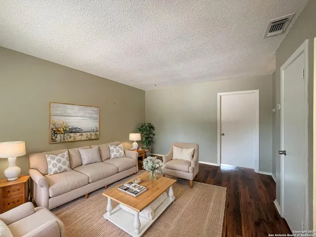 a living room with furniture and a couch