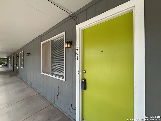a view of a bathroom with a glass door