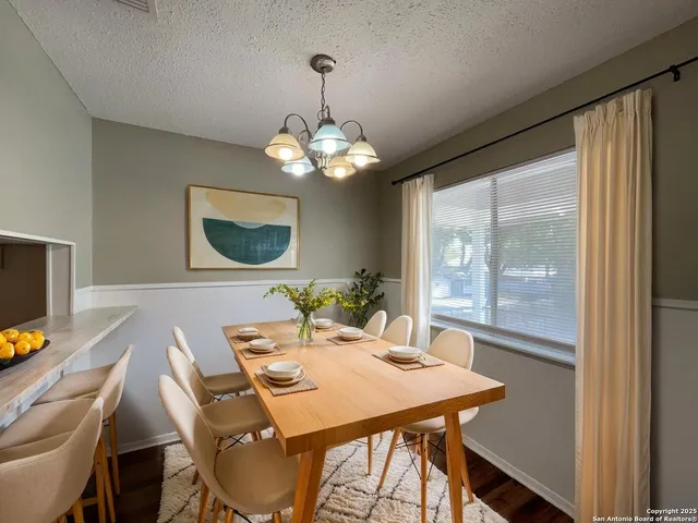 a view of a dining room with furniture window and outside view