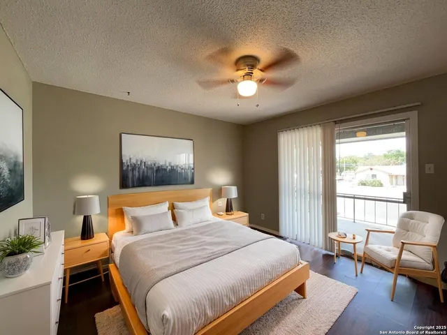 a bedroom with a large bed and a couch