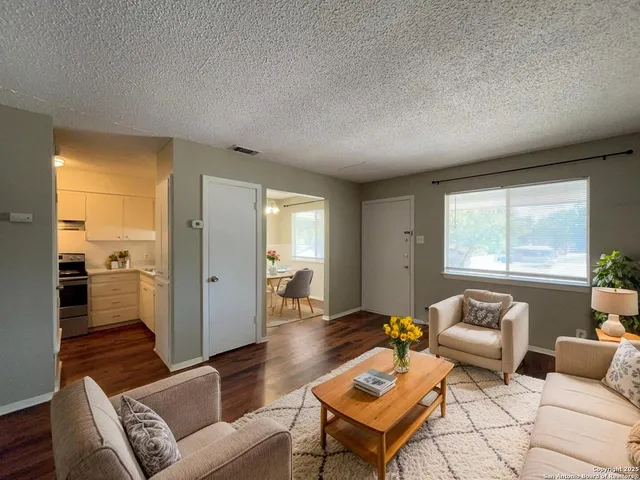 a living room with furniture and a window