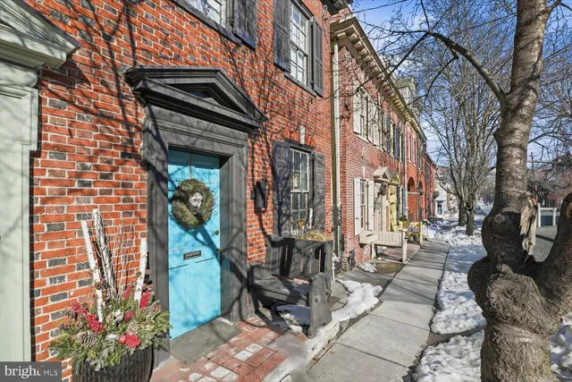 a view of a brick building with many windows