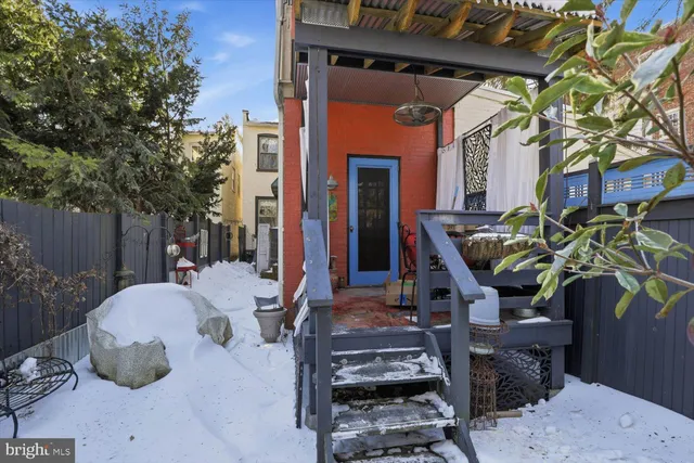 a view of a chairs and table in a patio