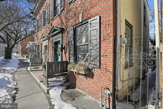 a dining room with furniture and a fireplace