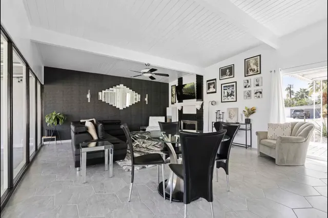 a dining room with furniture and window