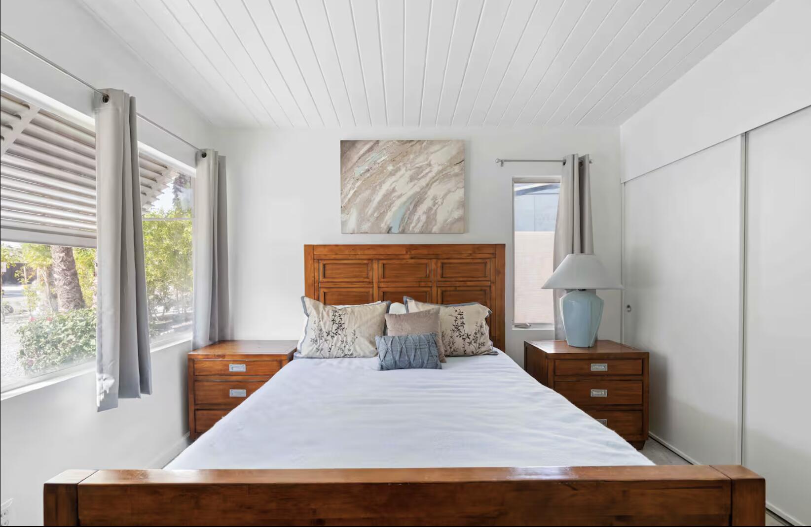 280 North Monterey Road Palm Springs, CA 92262 - Photo 17 of 29 a bedroom with a bed and wooden floor