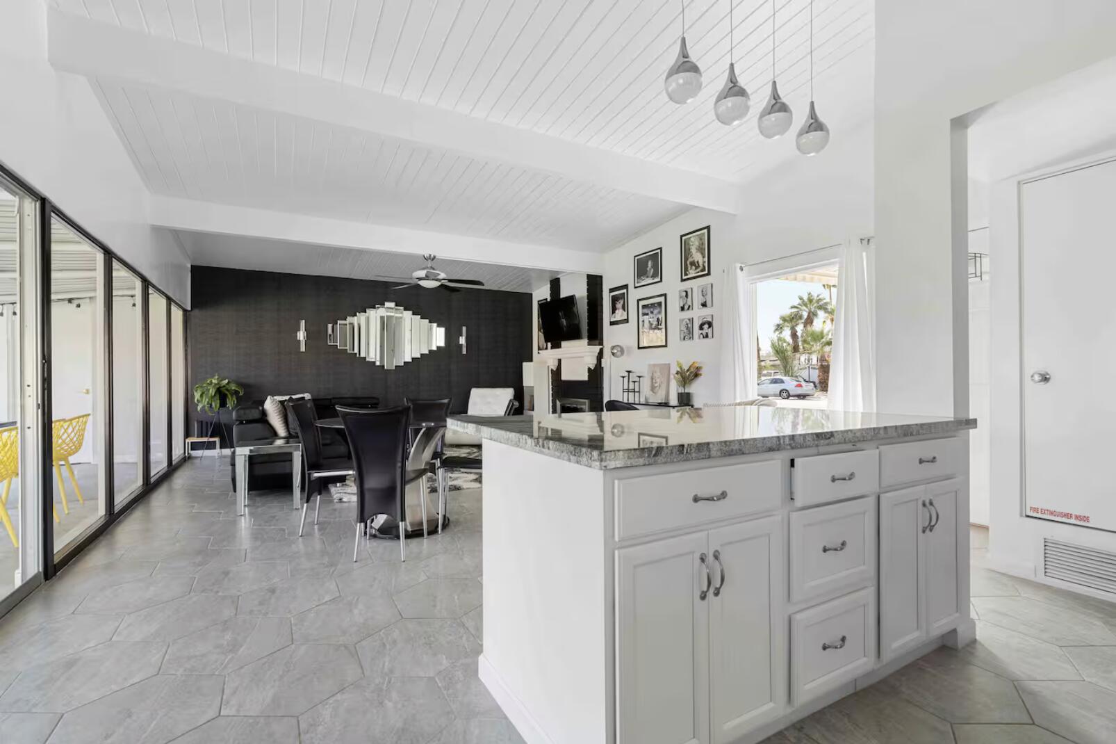 280 North Monterey Road Palm Springs, CA 92262 - Photo 29 of 29 a kitchen with granite countertop cabinets and chairs