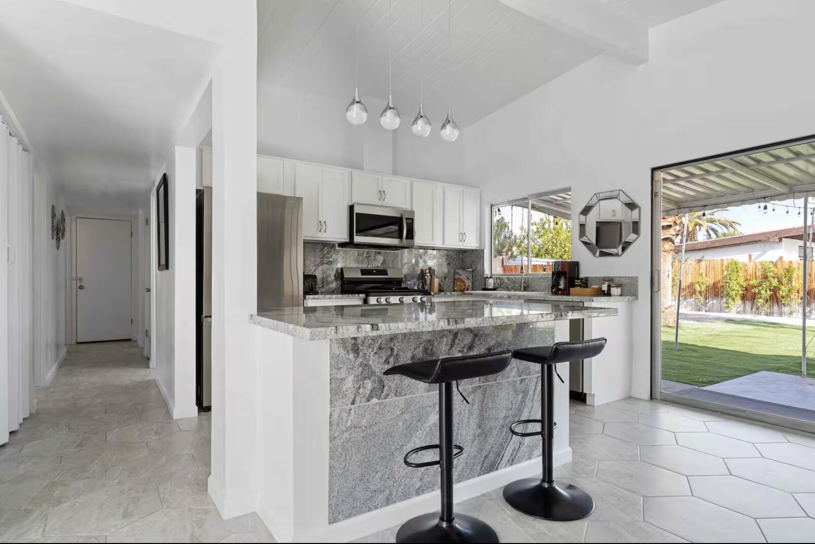 280 North Monterey Road Palm Springs, CA 92262 - Photo 6 of 29 a kitchen with stainless steel appliances a stove a refrigerator and a sink