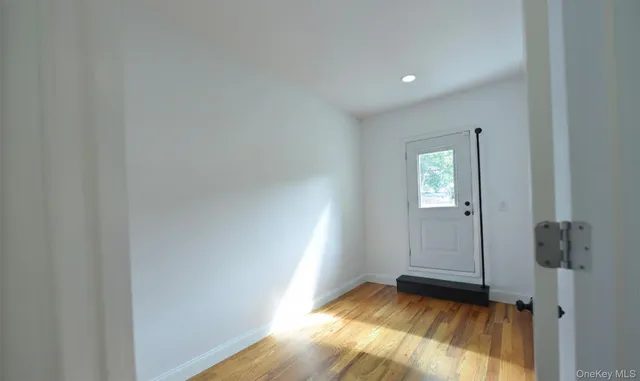 a view of an empty room and window