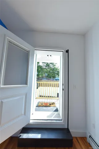 a view of a livingroom with wooden floor