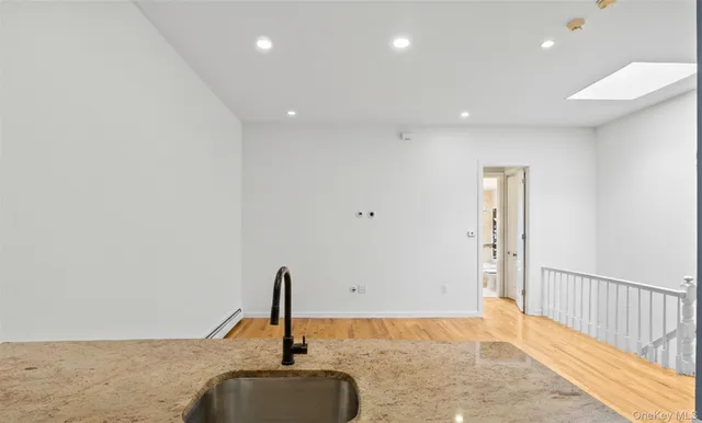 a view of a hallway with a room