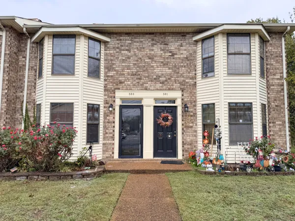 front view of a house with a yard