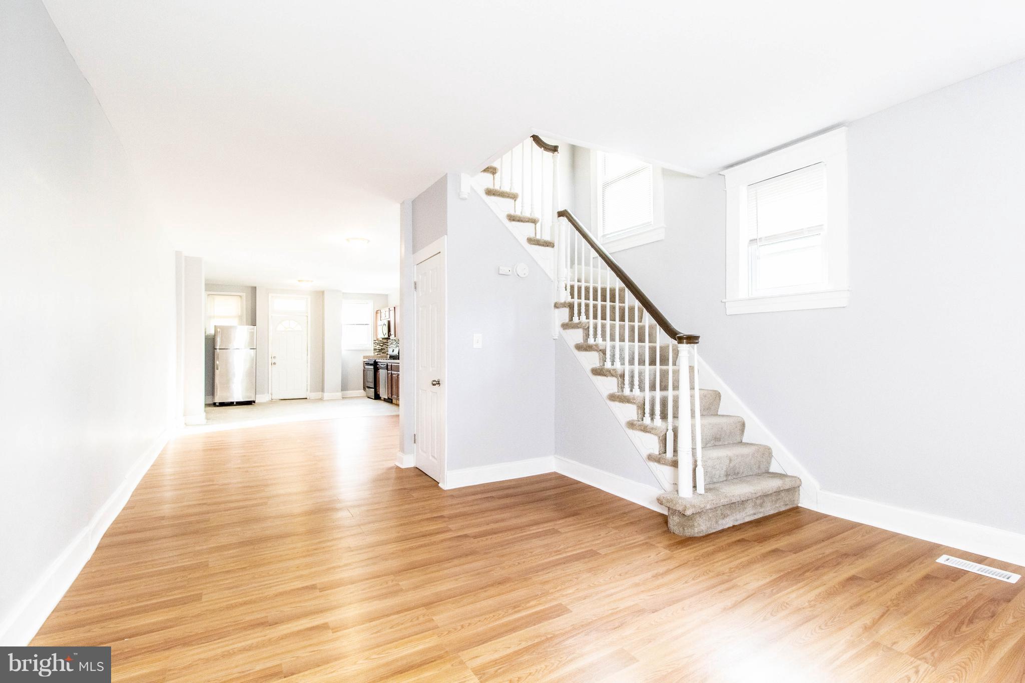 605 Benninghaus Road Baltimore, MD 21212 - Photo 1 of 30 a view of a hallway with wooden floor and staircase