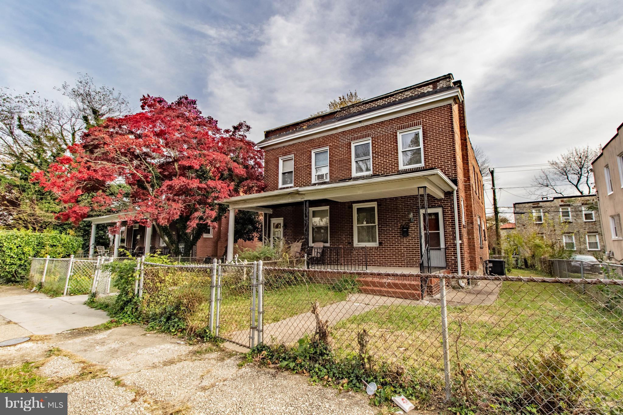 605 Benninghaus Road Baltimore, MD 21212 - Photo 27 of 30 a front view of a house with a yard table and chairs