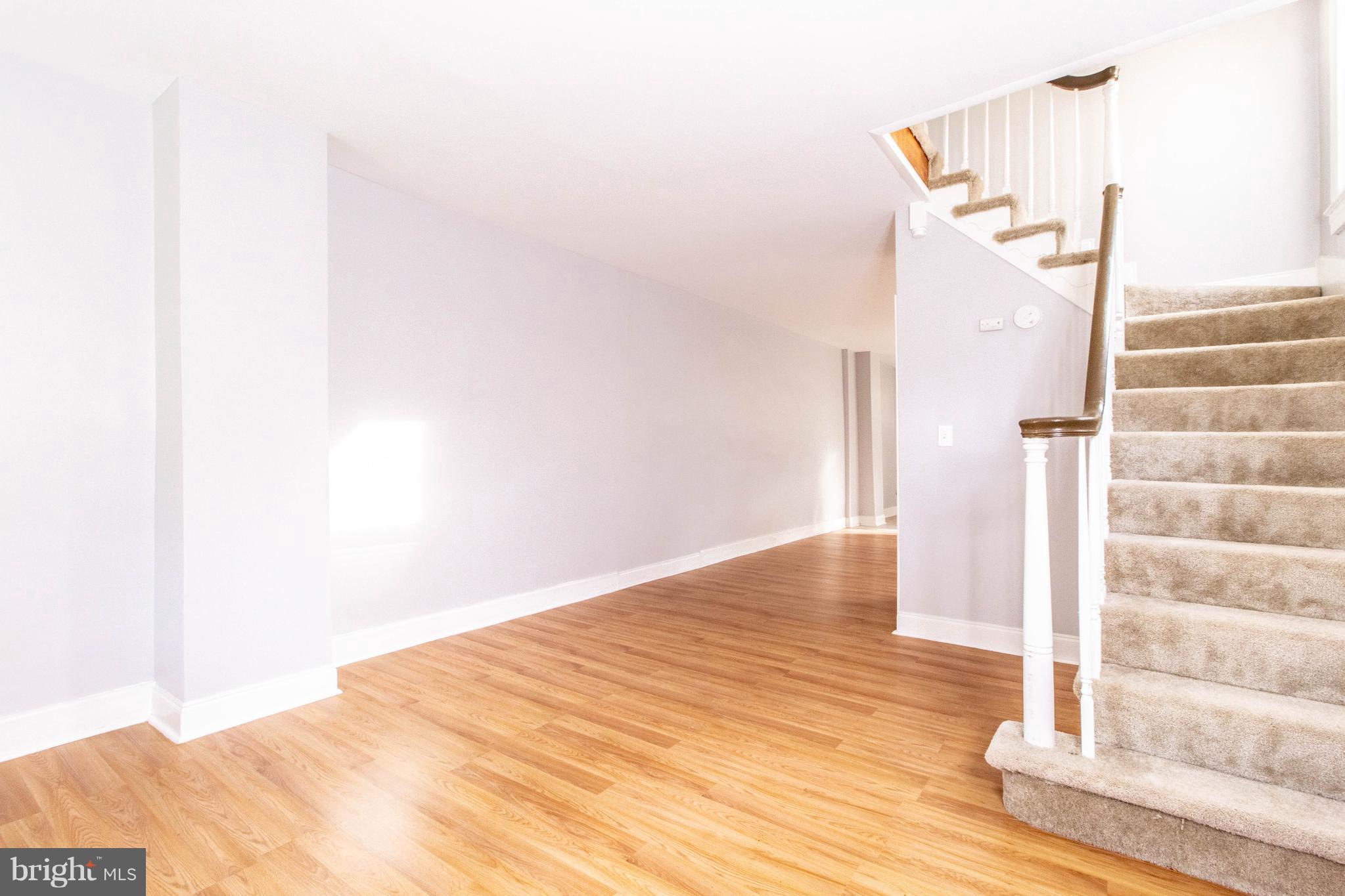 605 Benninghaus Road Baltimore, MD 21212 - Photo 4 of 30 a view of empty room with wooden floor