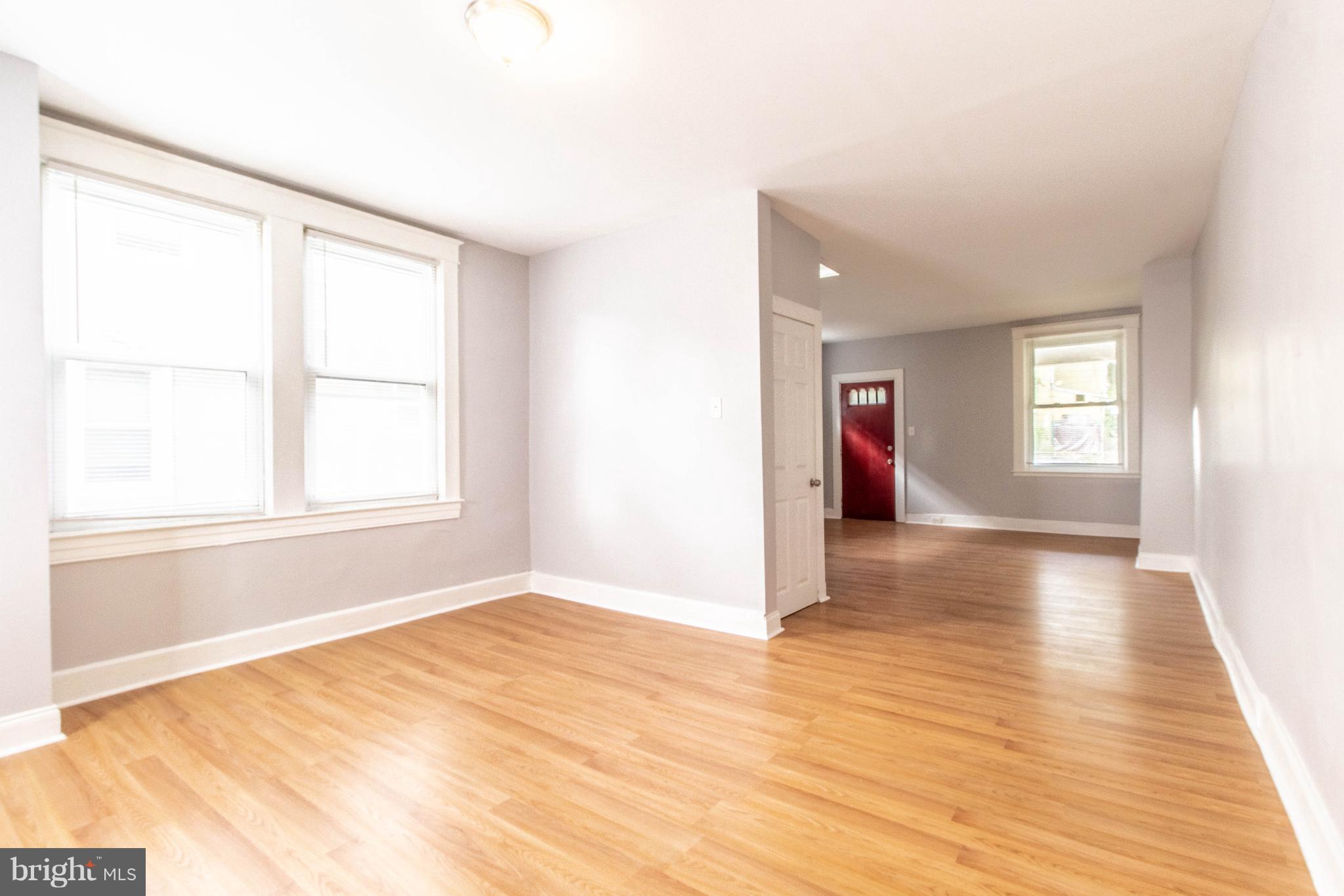605 Benninghaus Road Baltimore, MD 21212 - Photo 5 of 30 a view of empty room with wooden floor and fan