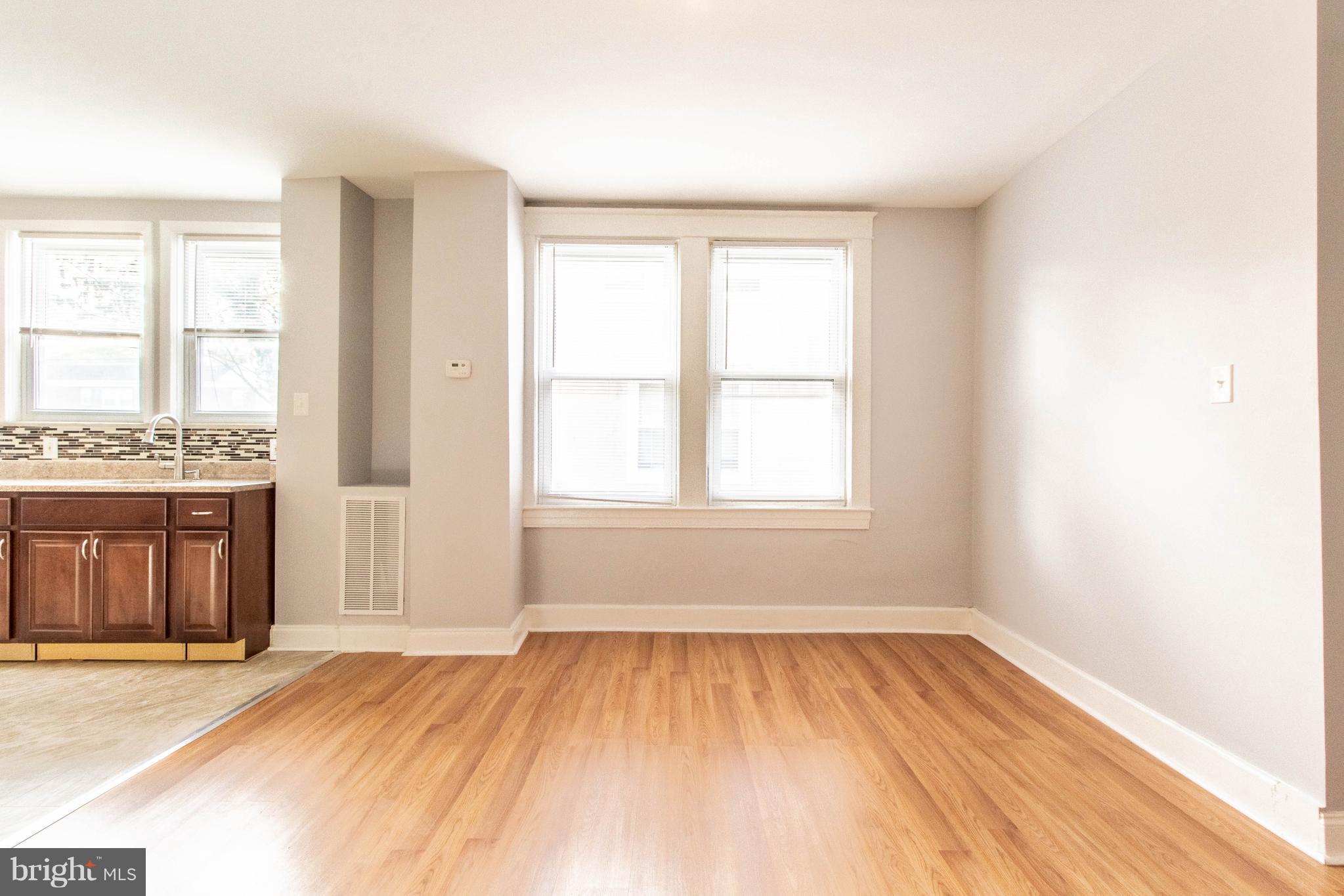 605 Benninghaus Road Baltimore, MD 21212 - Photo 9 of 30 wooden floor in an empty room with a window