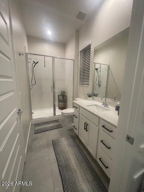 9625 West Monterey Way, Unit B Phoenix, AZ 85392 - Photo 11 of 22 a bathroom with a double vanity sink mirror double and shower