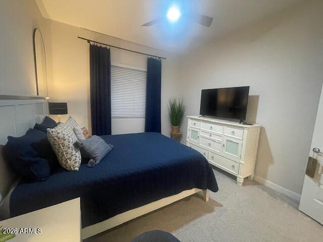 9625 West Monterey Way, Unit B Phoenix, AZ 85392 - Photo 15 of 22 a bedroom with a bed and a flat screen tv