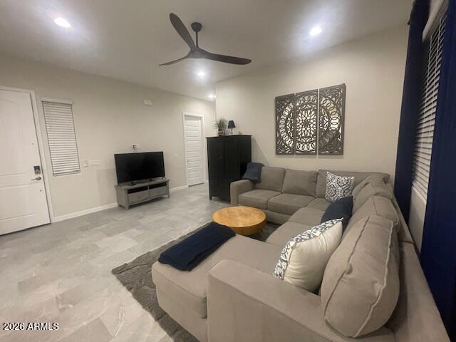 9625 West Monterey Way, Unit B Phoenix, AZ 85392 - Photo 2 of 22 a living room with furniture and a flat screen tv
