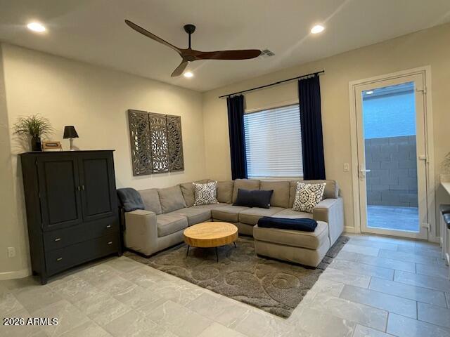 9625 West Monterey Way, Unit B Phoenix, AZ 85392 - Photo 5 of 22 a living room with furniture and a ceiling fan