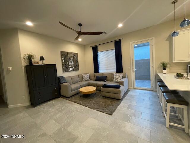 9625 West Monterey Way, Unit B Phoenix, AZ 85392 - Photo 6 of 22 a living room with furniture and a wooden floor