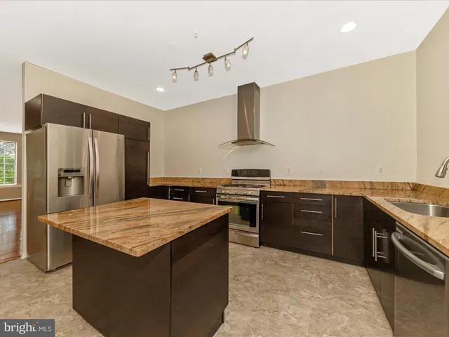 a kitchen with a stove and a sink