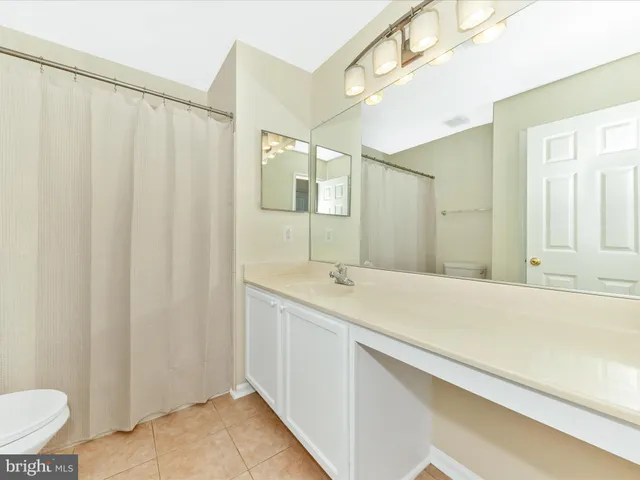 front view of a house with a tree