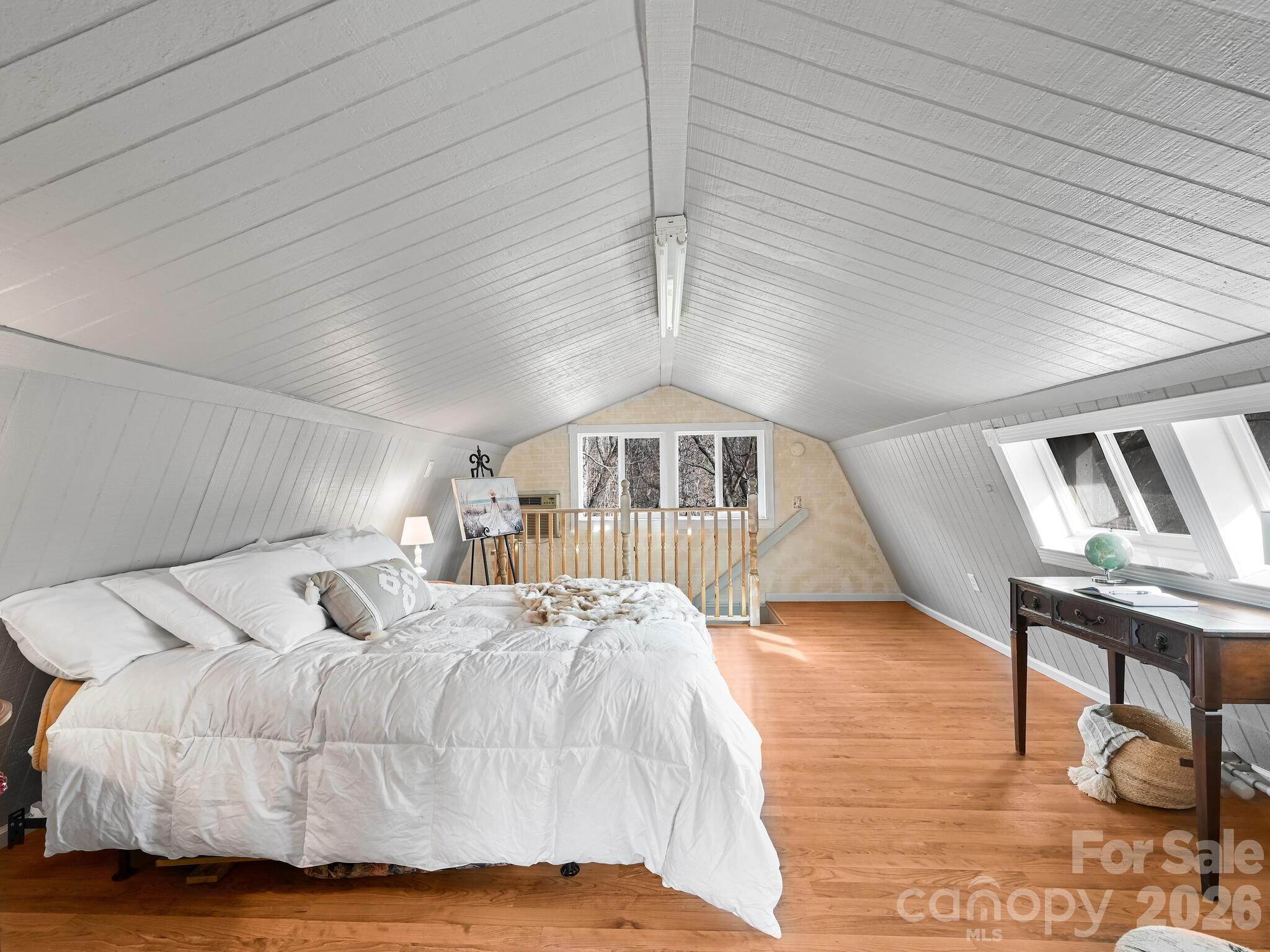90 Davidson Gap Road Leicester, NC 28748 - Photo 24 of 46 a bed sitting in a spacious bedroom next to a larger window