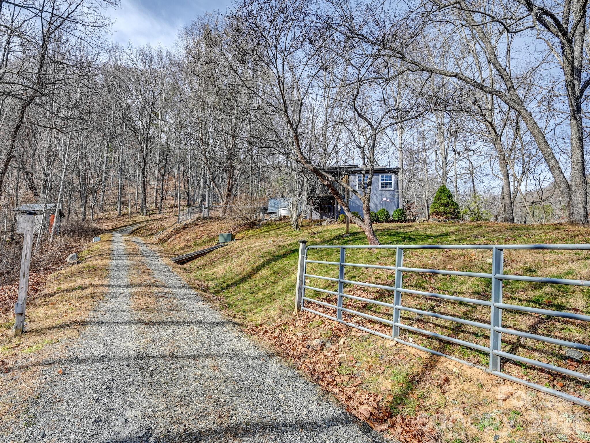90 Davidson Gap Road Leicester, NC 28748 - Photo 36 of 46 a view of a yard with basketball court
