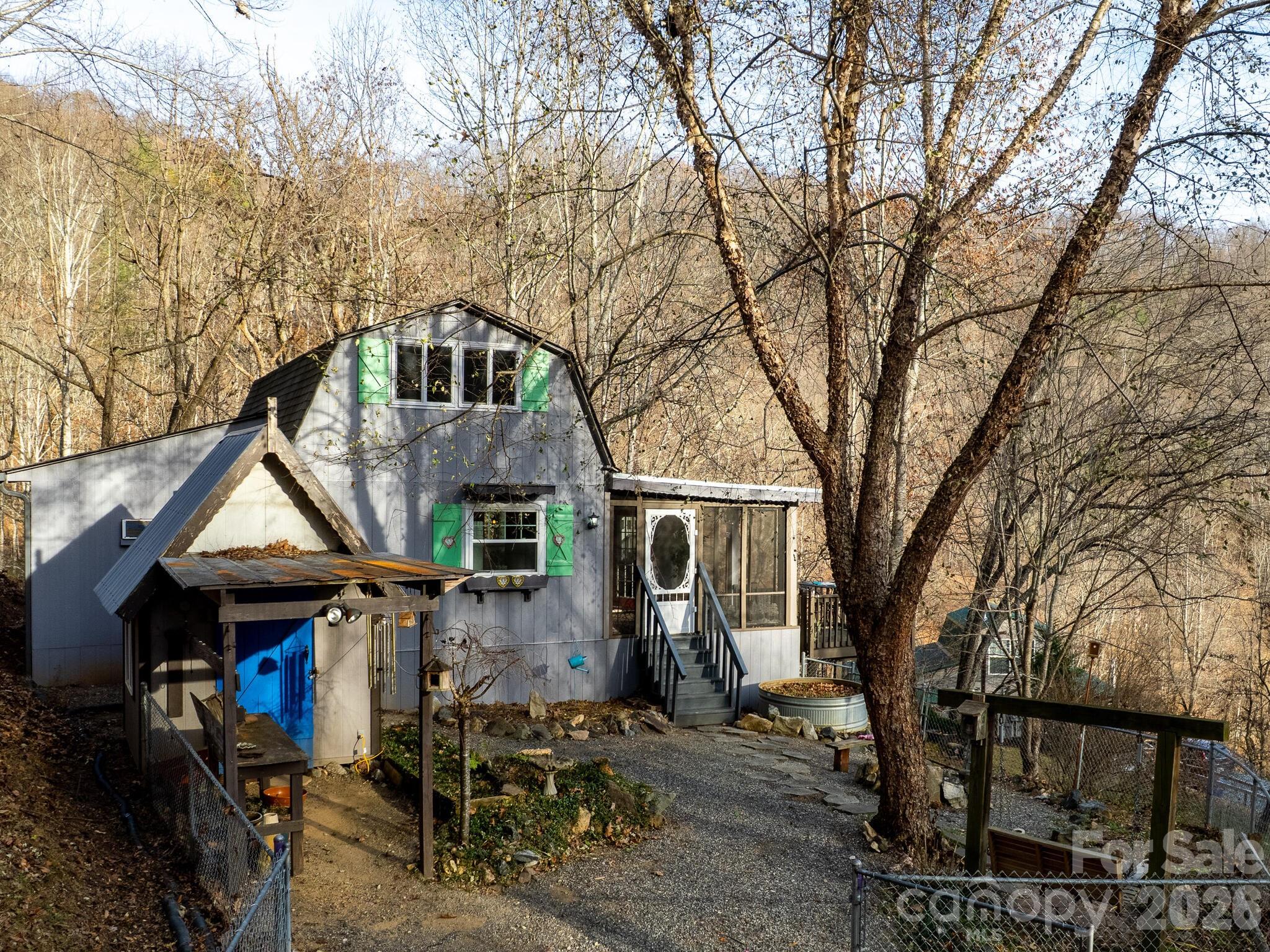 90 Davidson Gap Road Leicester, NC 28748 - Photo 39 of 46 a front view of a house with garden