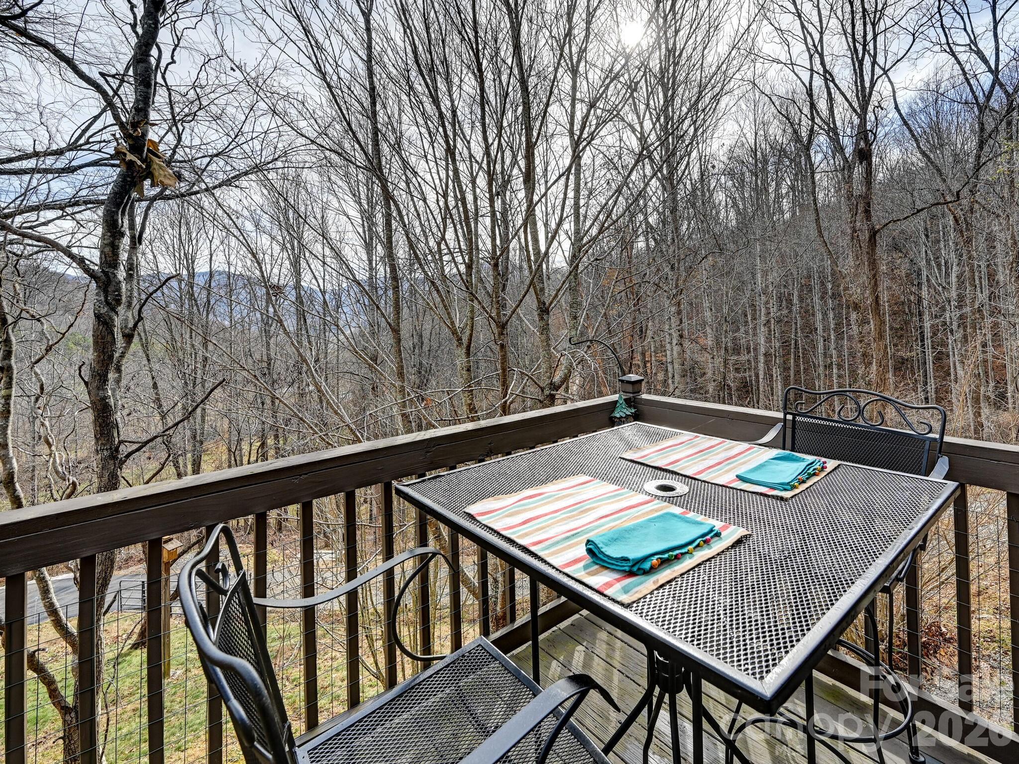 90 Davidson Gap Road Leicester, NC 28748 - Photo 5 of 46 a view of a balcony with furniture