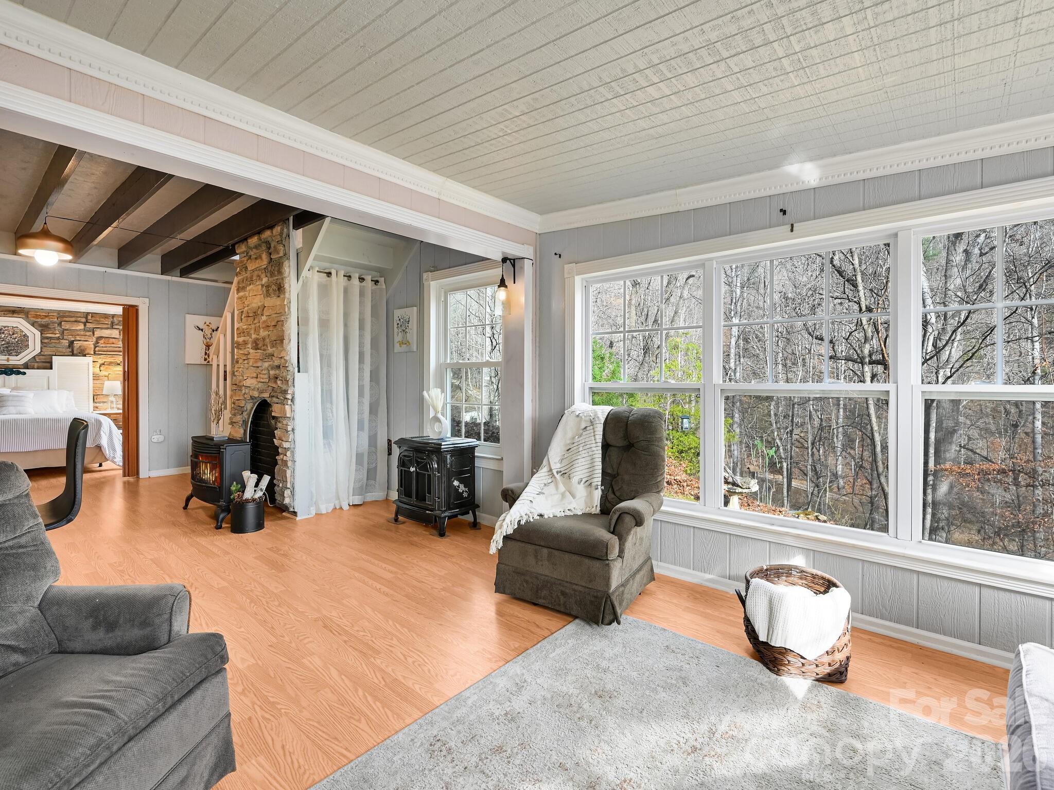 90 Davidson Gap Road Leicester, NC 28748 - Photo 8 of 46 a living room with furniture and a large window