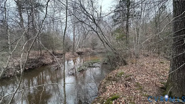 a view of a lake with top of house