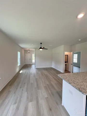 a view of a kitchen counter space and wooden floor