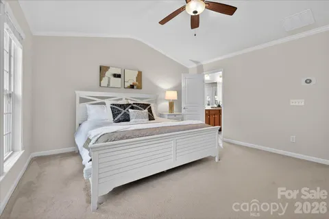 a bedroom with bed and window