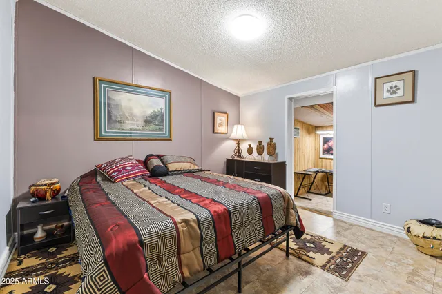 a bed room with a bed and a desk