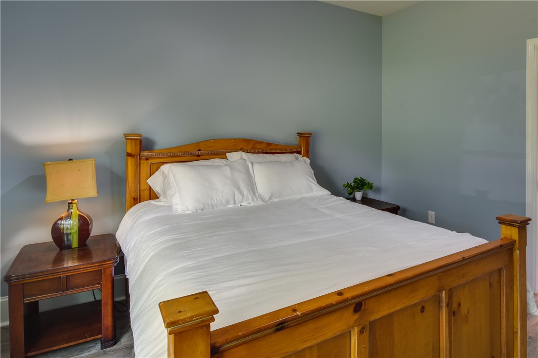 206 Petty Road Seneca, SC 29672 - Photo 20 of 48 A well-appointed sleeping area with light flooring and ample space for rest.