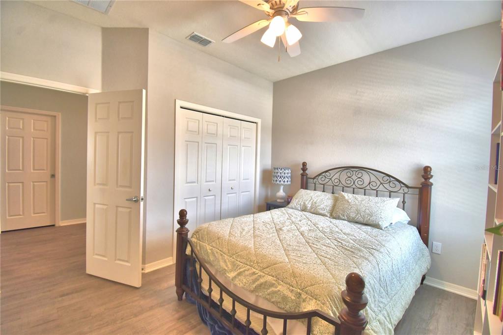 4340 Reding Way Lakeland, FL 33813 - Photo 28 of 63 a bedroom with a bed and a chandelier