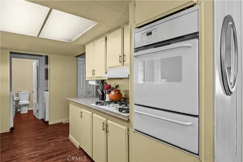 a kitchen with stainless steel appliances a refrigerator sink and cabinets
